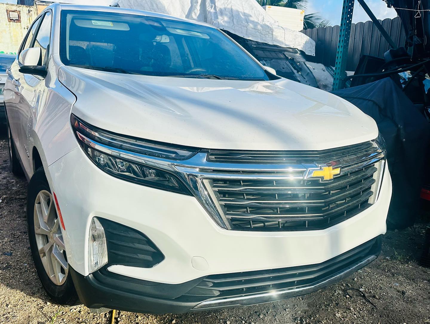 White Chevrolet Equinox front grille repair