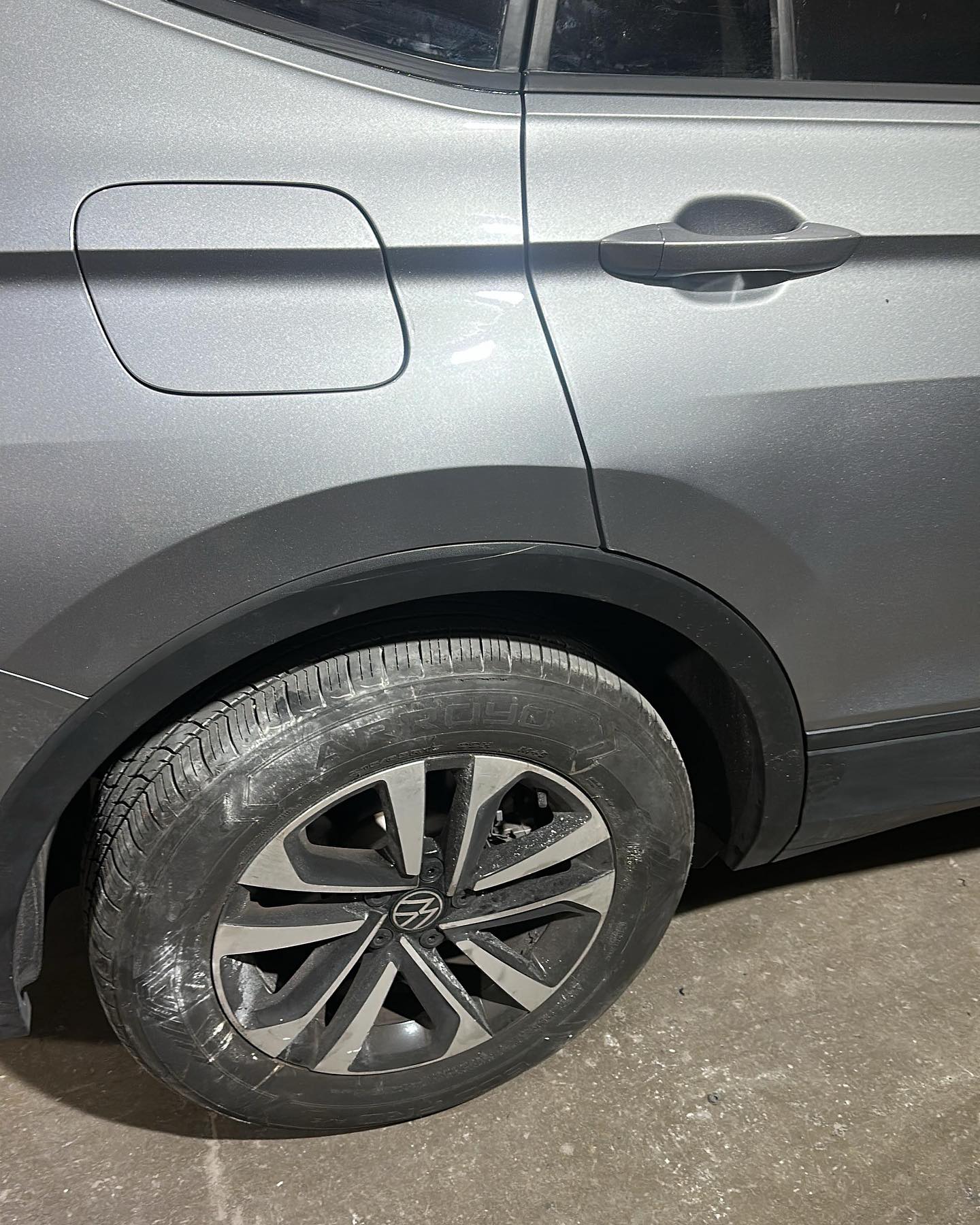Silver Volkswagen fender and wheel repair