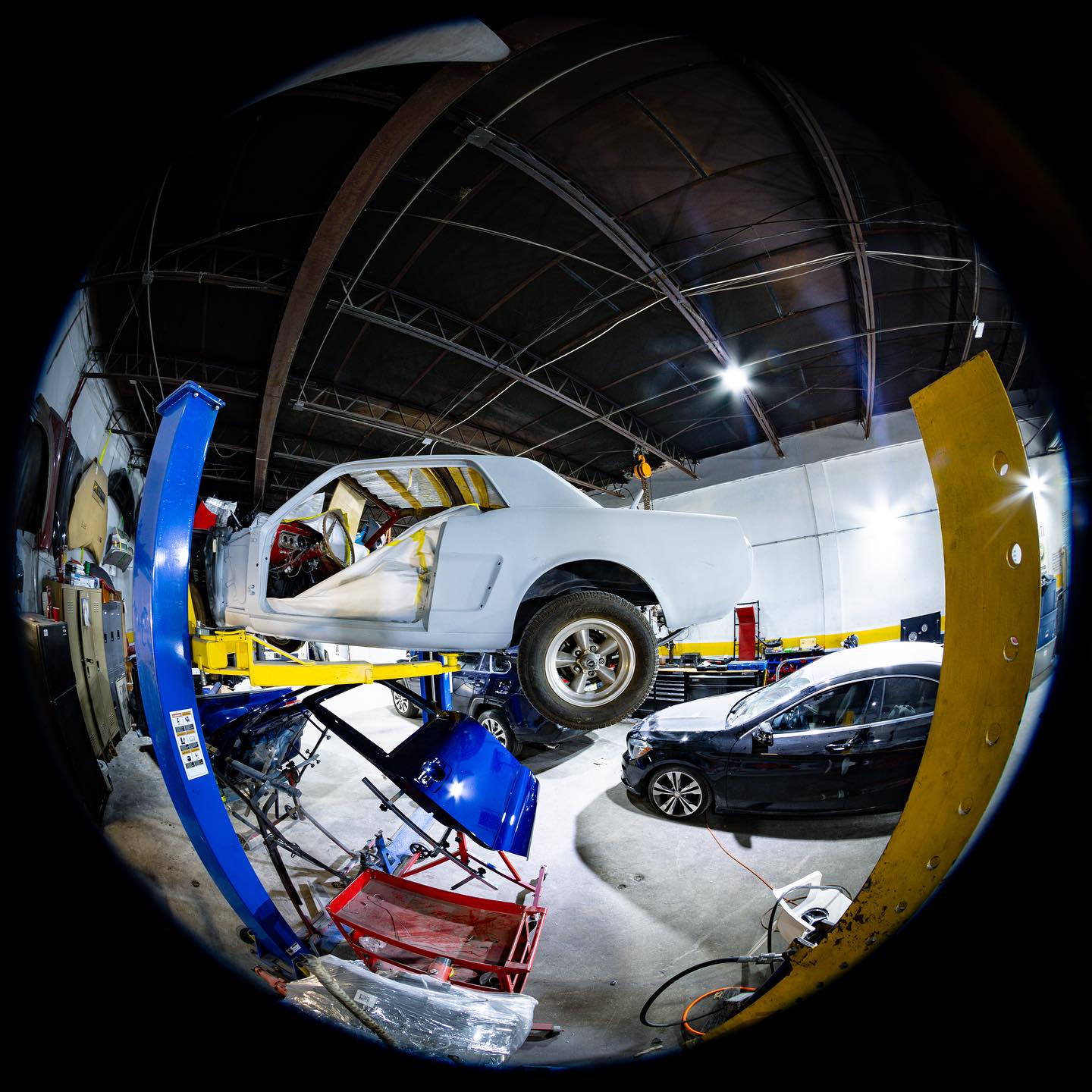 Inside Palm Beach Auto Body Shop, fisheye view of the paint bay